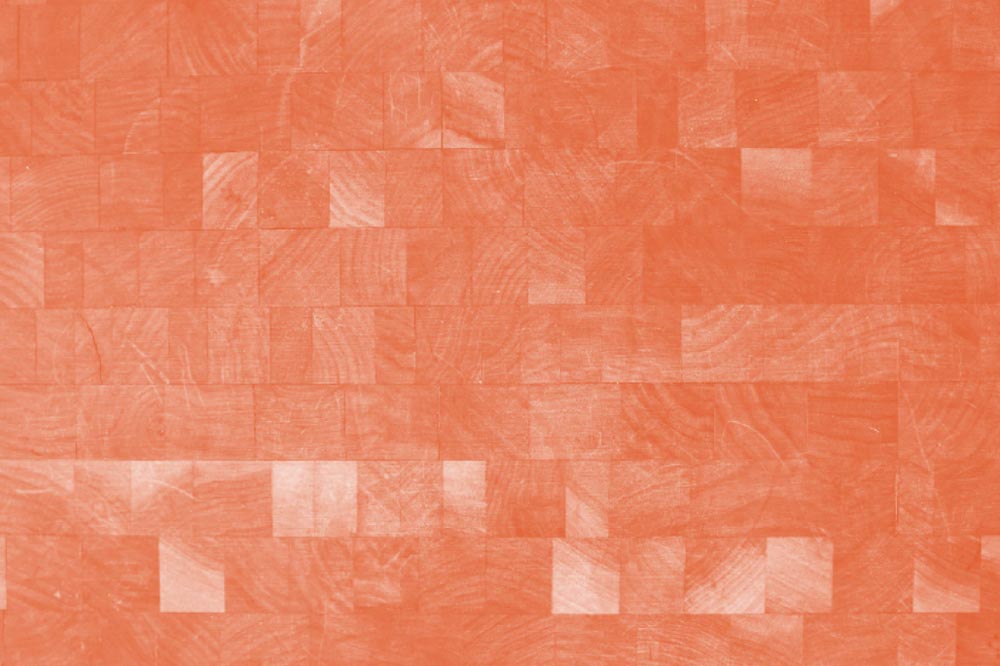 wall of woodblock squares with orange overlay